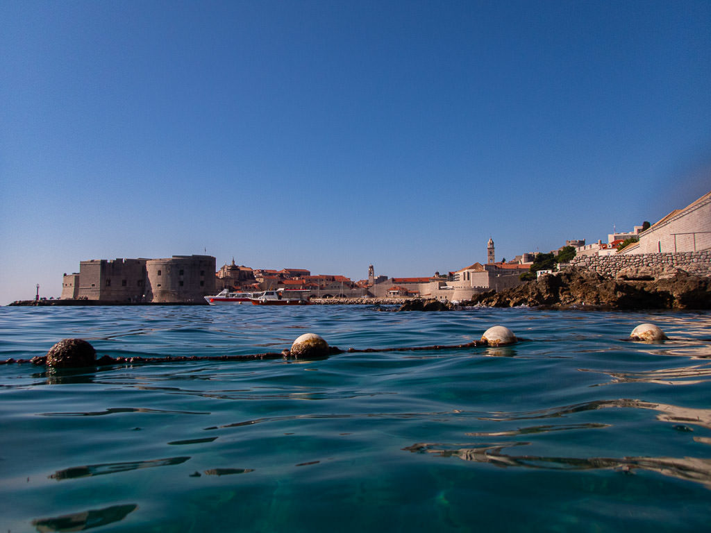 View of Dubrovnik Old Town port from Banje Beach, one of the best beaches in Dubrovnik