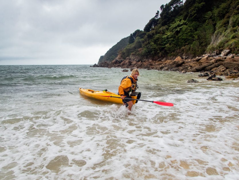 Abel Tasman Kayaks guide explaining how to enter the kayak in Awaroa Bay