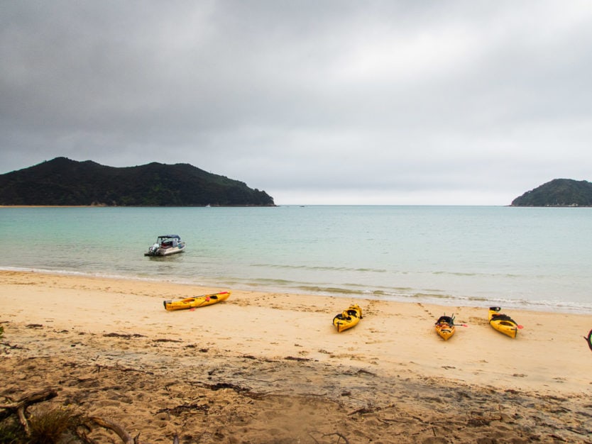 kayaks on the beach at Onetahuti bay