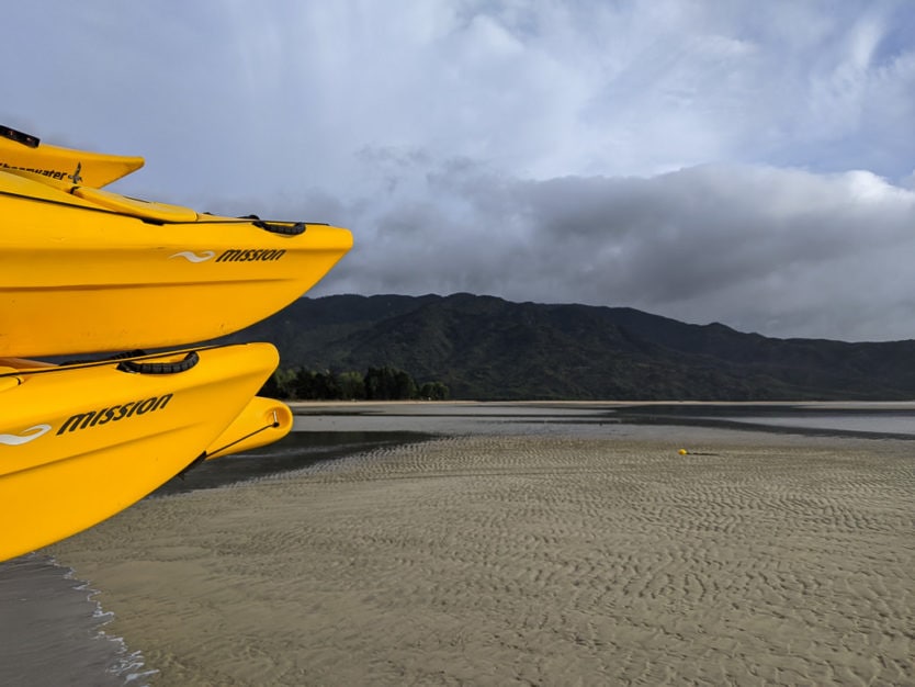 sea kayaks about to go on an adventure in abel tasman national park