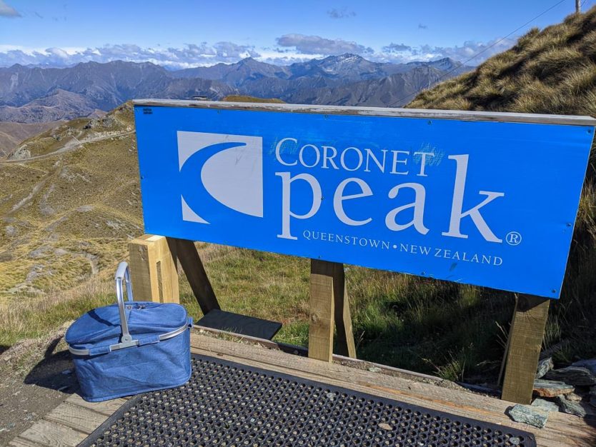 picnic basket with mountain views from atop coronet peak