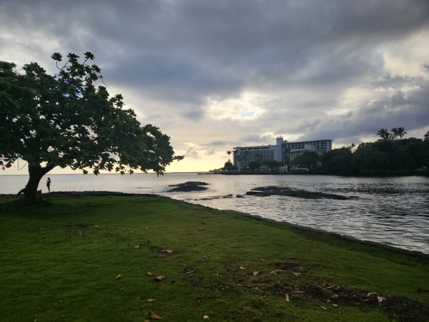 sunrise at grand naniloa hilo hotel from coconut island, an affordable hawaii oceanfront hotel