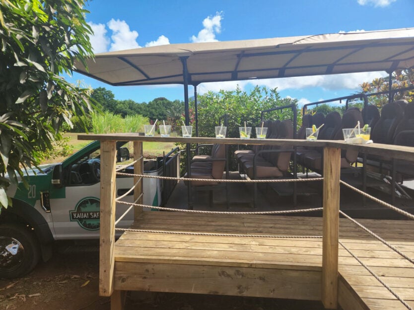 empty glasses next to safari truck for kauai farm tour with cocktails 